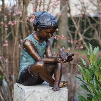 Bronzen beeld Meisje met vogel 50x27x45cm 11kg